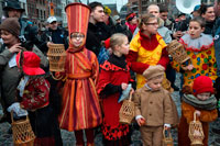 Binche festival carnival in Belgium Brussels. Children and teenagers dressed with costumes.  Music, dance, party and costumes in Binche Carnival. Ancient and representative cultural event of Wallonia, Belgium. The carnival of Binche is an event that takes place each year in the Belgian town of Binche during the Sunday, Monday, and Tuesday preceding Ash Wednesday. The carnival is the best known of several that take place in Belgium at the same time and has been proclaimed as a Masterpiece of the Oral and Intangible Heritage of Humanity listed by UNESCO. Its history dates back to approximately the 14th century.
